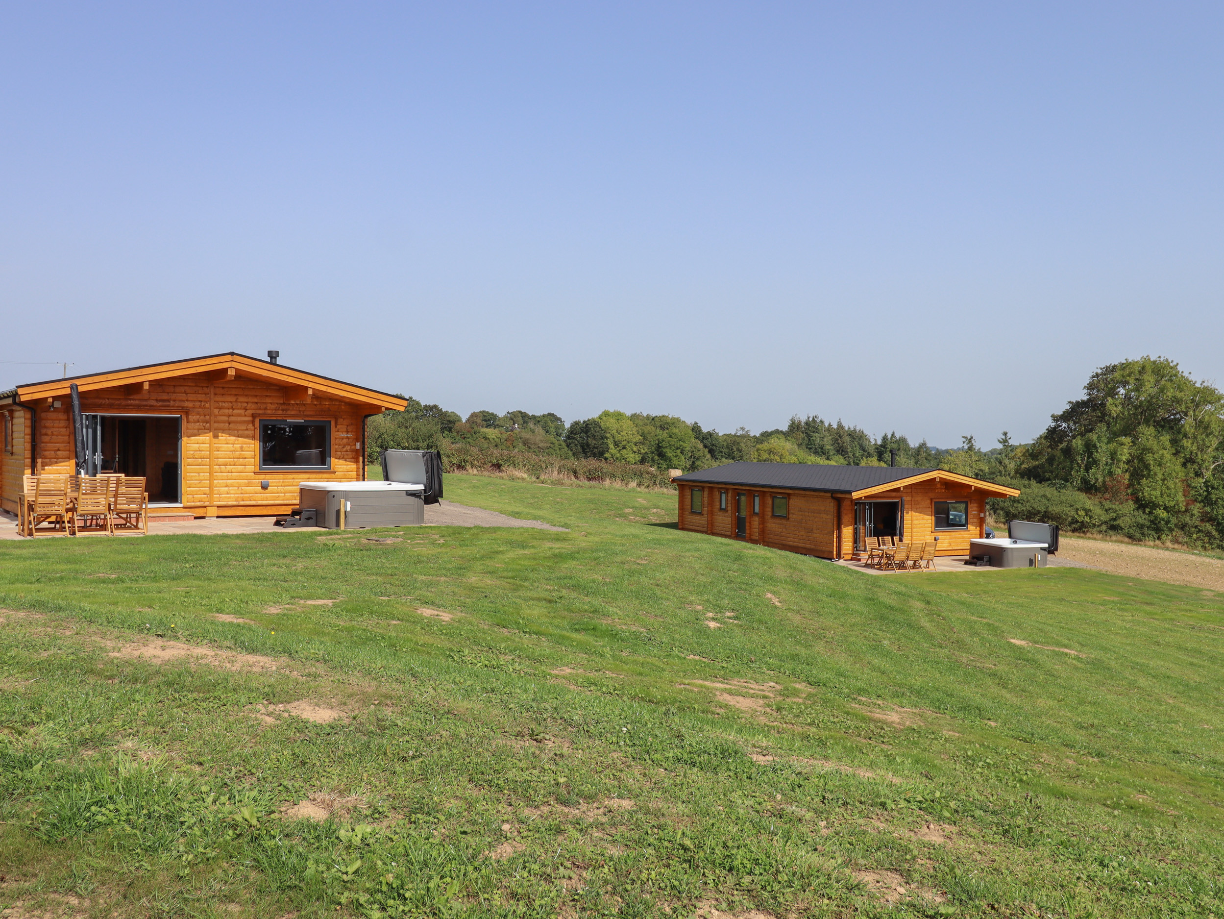 Foxglove Lodge in Hittisleigh, Devon. Detached lodge. Open-plan living space with woodburning stove.