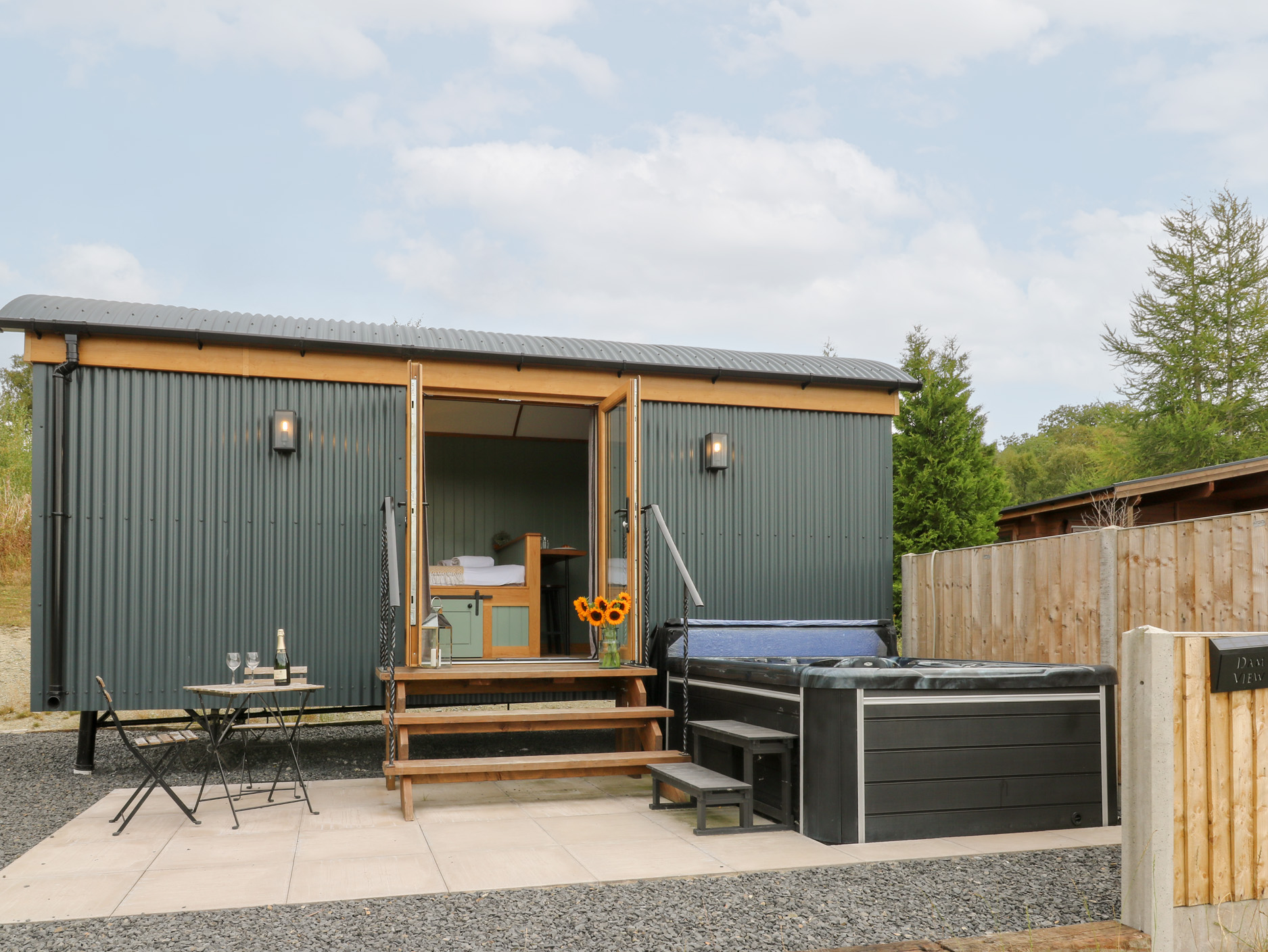 Dam View Shepherds Hut in Rhayader, Powys. Couple's retreat. Open-plan living. Mountain views. WiFi.